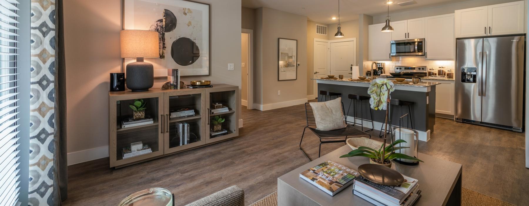 a kitchen with a bar and dining table